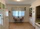 Eat-in kitchen with a small table by the window and storage at 750 Charlie Taylor Rd, Plant City, FL 33566