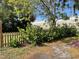 Landscaping featuring green shrubbery in front of the yard and trees overhead at 750 Charlie Taylor Rd, Plant City, FL 33566