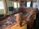 Bright living room with a leather sofa, vintage typewriter chest and combination kitchenette at 750 Charlie Taylor Rd, Plant City, FL 33566