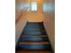 Staircase with wooden steps and handrail leading to the upper level at 750 Charlie Taylor Rd, Plant City, FL 33566