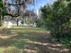 Spacious yard with mature oak trees draped in Spanish moss offering plenty of shade at 750 Charlie Taylor Rd, Plant City, FL 33566