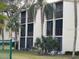 A well-maintained two-story condo with screened in patios at 1415 Doolittle Ln # 107, Dunedin, FL 34698