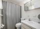 Standard bathroom with a shower/tub, toilet, and sink with a mirrored vanity at 250 Rosery Nw Rd # 260, Largo, FL 33770