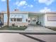 Charming single-story home with a covered parking area and well-maintained landscaping at 250 Rosery Nw Rd # 260, Largo, FL 33770