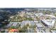 A high-angle aerial view shows a neighborhood in a developed urban area with various building types at 2311 W Morrison Ave # 13, Tampa, FL 33629