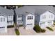 Aerial view of townhomes showcasing the home's roof, garage and driveway at 2311 W Morrison Ave # 13, Tampa, FL 33629
