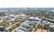 A landscape aerial shows community townhomes, with a pool, businesses, and the city skyline nearby at 2311 W Morrison Ave # 13, Tampa, FL 33629