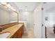 Bright bathroom features double sinks, granite countertops, and a large mirror at 2311 W Morrison Ave # 13, Tampa, FL 33629