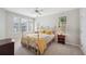 This bedroom features natural lighting and a ceiling fan at 2311 W Morrison Ave # 13, Tampa, FL 33629