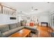 Spacious living room with hardwood floors, neutral tones, and comfortable seating, ideal for relaxation and entertaining at 2311 W Morrison Ave # 13, Tampa, FL 33629