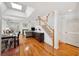 Bright and airy living room with hardwood floors, a fireplace, and a staircase leading to the upper level at 2311 W Morrison Ave # 13, Tampa, FL 33629