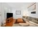 Comfortable living room with plush seating, hardwood floors, and natural light at 2311 W Morrison Ave # 13, Tampa, FL 33629