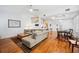 Bright and airy living room featuring hardwood floors and staircase at 2311 W Morrison Ave # 13, Tampa, FL 33629