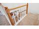 Carpeted staircase with wood railing and white spindles at 2311 W Morrison Ave # 13, Tampa, FL 33629