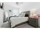 Serene bedroom with soft lighting, a comfortable bed, and elegant bedside decor at 11658 Bluestone Ct, Parrish, FL 34219