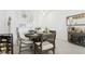 Charming dining room features stylish décor, warm lighting, and a lovely round table at 11658 Bluestone Ct, Parrish, FL 34219