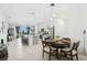 Bright open-concept kitchen with stainless steel appliances, an island, and eat-in dining area at 11658 Bluestone Ct, Parrish, FL 34219