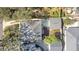 This aerial view showcases the home's layout, driveway, and surrounding landscaping with mature trees at 319 W Giddens Ave # 1/2, Tampa, FL 33603