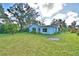 View of the back of the house and the backyard at 1413 May St, Lutz, FL 33548