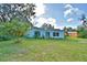 View of the house and the backyard at 1413 May St, Lutz, FL 33548