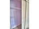 Small closet with lavender walls and wire shelving at 1413 May St, Lutz, FL 33548