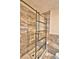 Bathroom features a shower with marbled walls and a glass door at 1413 May St, Lutz, FL 33548