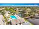 Aerial view of a community pool with a lake, a wooden bridge and a gazebo at 6350 92Nd N Pl # 2206, Pinellas Park, FL 33782