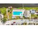 Aerial view of community pool and spa next to canal at 6350 92Nd N Pl # 2206, Pinellas Park, FL 33782