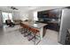 Open concept kitchen seamlessly flows into the living room, featuring granite countertops and modern appliances at 8680 Falling Blue Pl, Riverview, FL 33578