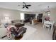 Spacious open-concept kitchen, living room and dining area with stylish decor and lots of natural light at 8680 Falling Blue Pl, Riverview, FL 33578