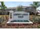 Osprey Lakes West community sign with pretty landscaping and water feature at 8680 Falling Blue Pl, Riverview, FL 33578