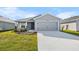 Charming one-story home featuring a well-manicured lawn and a spacious two-car garage at 6925 161St E Ter, Parrish, FL 34219