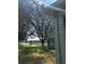 Spacious backyard with view of lake and mature trees at 8623 Snowy Owl Way, Tampa, FL 33647