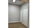 Neutral bedroom featuring hardwood flooring and a double door closet at 8623 Snowy Owl Way, Tampa, FL 33647