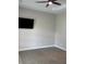 Bedroom with carpet and a mounted tv at 8623 Snowy Owl Way, Tampa, FL 33647