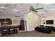 A modern clubhouse featuring a kitchenette with bar seating and a lounge area with comfortable seating at 8623 Snowy Owl Way, Tampa, FL 33647