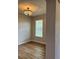 Dining room featuring hardwood flooring and a decorative chandelier at 8623 Snowy Owl Way, Tampa, FL 33647