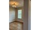 Dining room featuring hardwood flooring and a decorative chandelier at 8623 Snowy Owl Way, Tampa, FL 33647