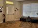 Entryway featuring hardwood floors, front door, and natural light at 8623 Snowy Owl Way, Tampa, FL 33647
