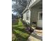 Inviting entrance with a walkway, flowerbeds, and decorative lights at 8623 Snowy Owl Way, Tampa, FL 33647
