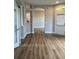 Spacious foyer featuring wood flooring and an arched doorway at 8623 Snowy Owl Way, Tampa, FL 33647