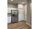Kitchen featuring stainless steel appliances, white cabinets, and hardwood flooring at 8623 Snowy Owl Way, Tampa, FL 33647