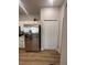 Modern kitchen features stainless steel refrigerator and ample storage at 8623 Snowy Owl Way, Tampa, FL 33647