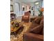Inviting living room featuring a patterned rug, modern furniture and natural light at 8623 Snowy Owl Way, Tampa, FL 33647