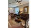 Comfortable living room featuring large windows, recessed lighting, and modern furniture at 8623 Snowy Owl Way, Tampa, FL 33647