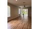 Well-lit living room with blinds and a ceiling fan at 8623 Snowy Owl Way, Tampa, FL 33647
