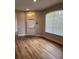 Living room with natural light, wood flooring, and a back door at 8623 Snowy Owl Way, Tampa, FL 33647