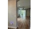 Bright, open living room with modern flooring and sliding glass doors to the outside at 8623 Snowy Owl Way, Tampa, FL 33647
