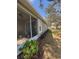 Enclosed patio with view of landscaped backyard at 8623 Snowy Owl Way, Tampa, FL 33647