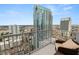 High-rise balcony with patio furniture showcasing a panoramic city view at 777 N Ashley Dr # 2313, Tampa, FL 33602